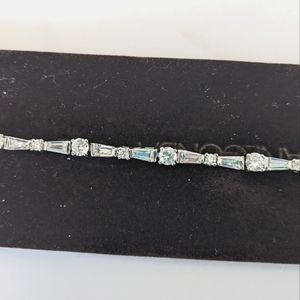 CZ tennis bracelet, little over 7 in long, with two safeties